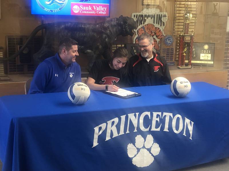 PHS senior Maya Gartin signs Tuesday to play volleyball for Sauk Valley under the watchful eye of PHS coach Andy Puck (left) and Sauk coach Jay Howell (right).