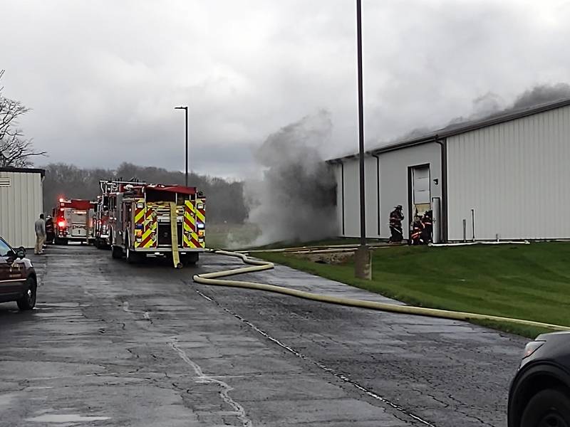 Smoke comes from a warehouse Thursday, April 4, 2024, at MTC Voyager Corp. on Titanium Drive in Ottawa.