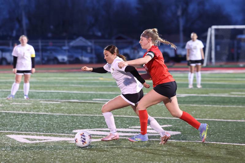 Herscher's Gianni Jaime breaks away from Bradley-Bourbonnais' Harper Tollefson during the Boilermakers' 4-3 victory on Monday, April 6, 2026.