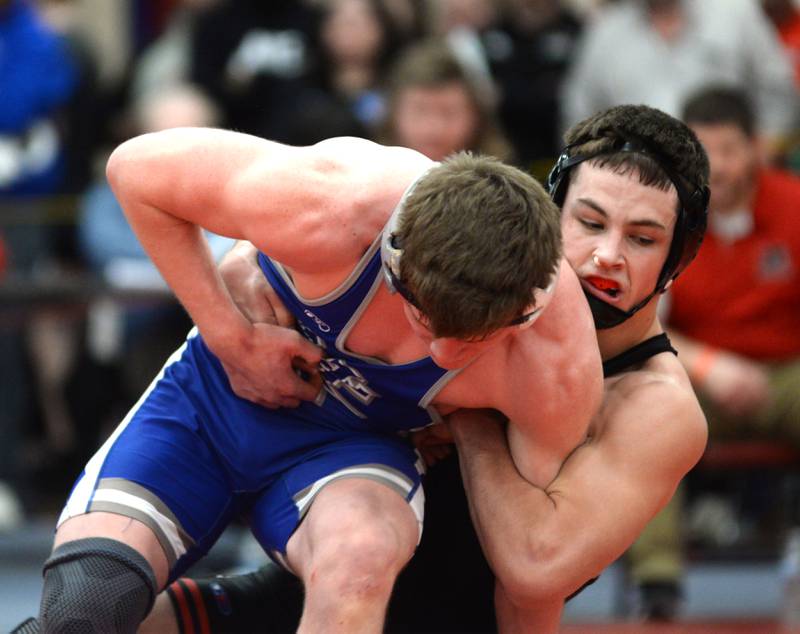 Erie-Prophetstown’s Wyatt Gossens pulls Sterling Newman’s Briar Ivey to the mat as they wrestle at 157 pounds at the 1A Oregon Sectional on Saturday, Feb. 15, 2025.