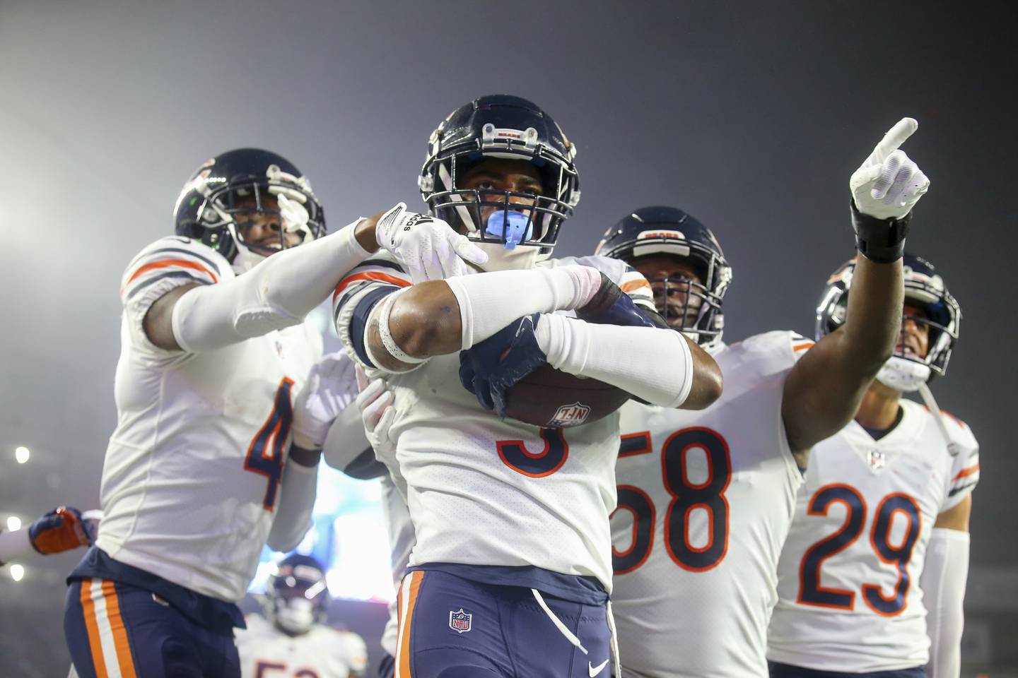 Chicago Bears safety Jaquan Brisker celebrates his interception with teammates during their Week 7 game against the New England Patriots, Monday, Oct. 24, 2022, in Foxborough, Mass.