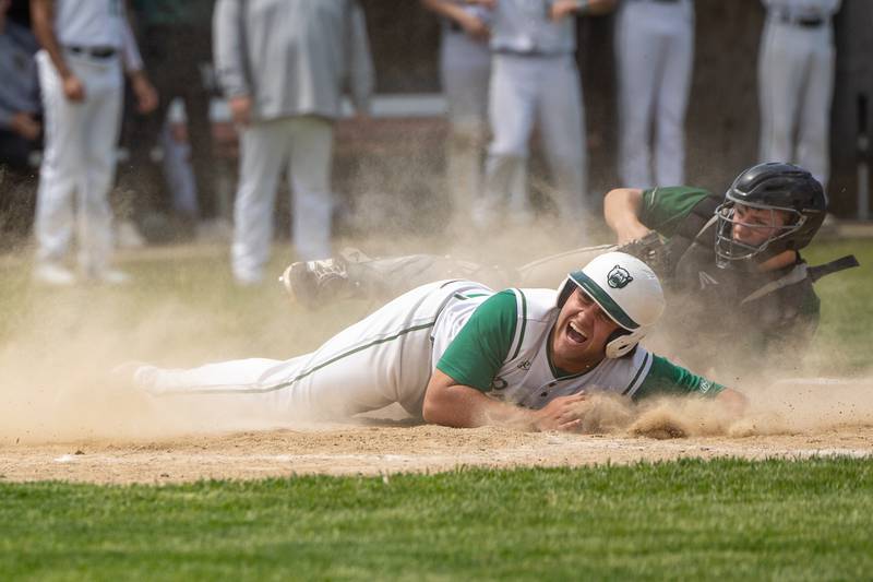 (22) Alan Spencer of St. Bede screams after being tagged at home plate by (30) Z. Schwanke of Midland on Saturday, May 24, 2025 at Stark County High School in Toulon.