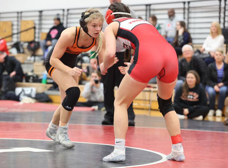 Minooka's Kira Cailteux prepares to wrestle Yorkville's Athena Westphal during the Southwest Prairie Conference wrestling meet at Yorkville High School on Saturday, Jan. 21, 2023.