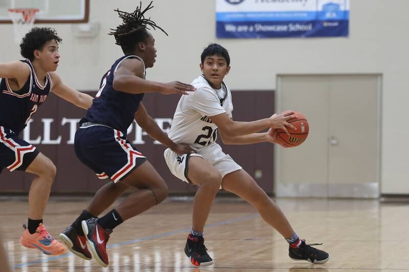 Joliet Catholic’s James Pilapil looks to pass out of pressure against St. Viator.