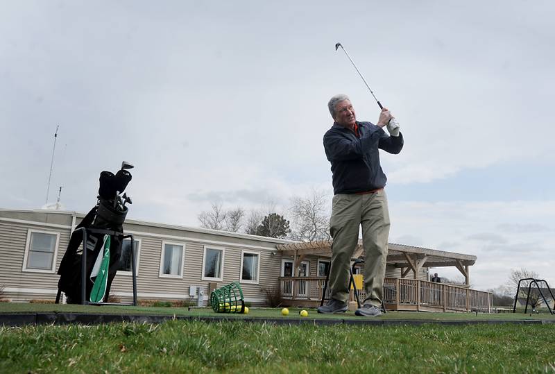John Streit hits golf ball Wednesday, April 27, 2022, at the driving range at RedTail Golf Club, 7900 Redtail Drive in the Village of Lakewood. The golf club will be building a new clubhouse later this year