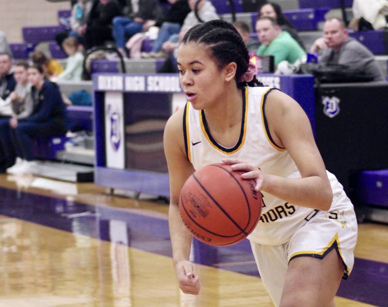 Sterling's Olivia Turner (4) goes baseline on the dribble drive Wednesday during the Dixon KSB Holiday Classic. She had 11 points in Sterling's 41-37 loss to Rockford Jefferson.