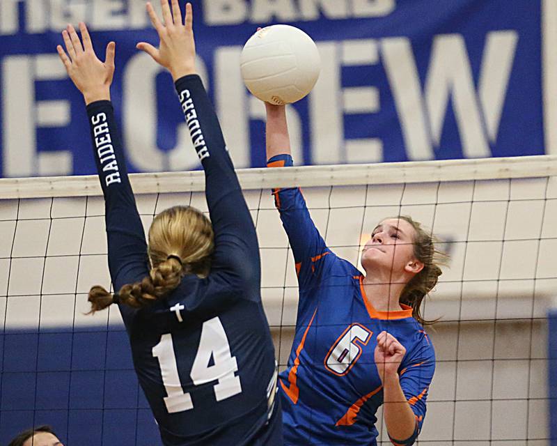 Genoa-Kingston's Kaitlin Rahn (6) sends a kill past Quincy Notre Dame's Abbey Schreacke (14) in the Class 2A Supersectional volleyball game on Friday, Nov. 4, 2022 at Princeton High School.