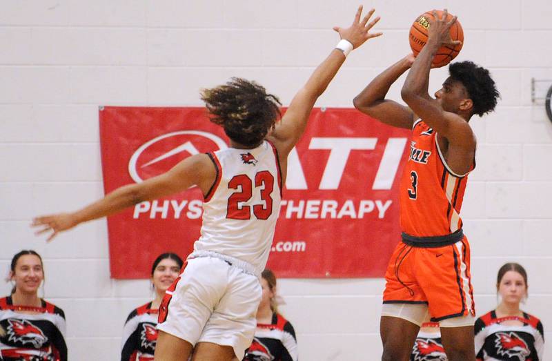 Romeoville's Meyoh Swansey (3) makes a three-point shot against Yorkville defender Jory Boley (23) during a boys' basketball game at Yorkville High School on Tuesday, Jan. 10, 2023.