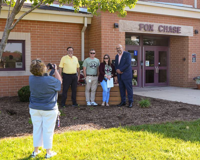 School board member Dominick Cirrone, left, Fox Chase elementary principal Jeff Renaldi, Vice principal Amy Steves and Oswego school board superintendent Andalid Khelghati all pose for a photo outside Fox Chase Elementary after welcoming students back to school on the first day of classes held on Wednesday Aug. 16, 2023.