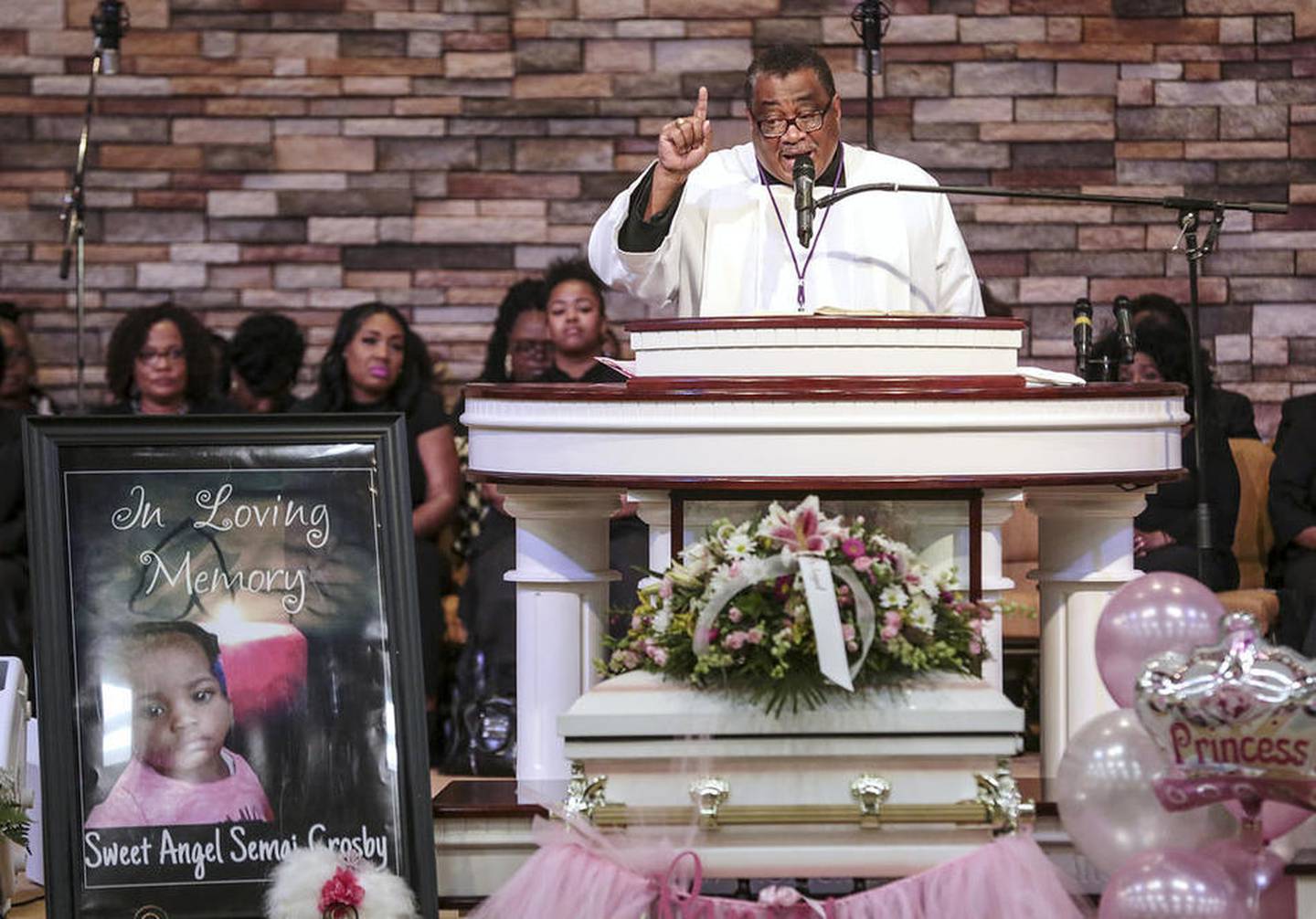 The Rev. Warren Dorris delivers a eulogy over the coffin of Sema'j Crosby on Friday, May 5, 2017, at Prayer Tower Ministries in Joliet, Ill. (Photo by Eric Ginnard - eginnard@shawmedia.com)