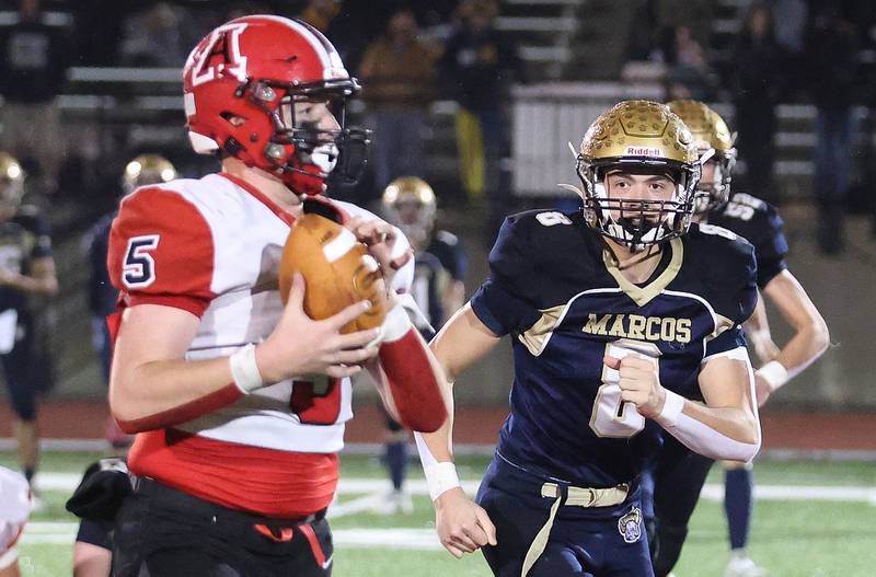 Amboy/LaMoille/Ohio's Rylan McNinch, makes an interception as Polo's Korbin Cavanaugh, chases him down during the 8-man I8FA championship game on Friday, Nov. 21, 2025 at April Zorn Memorial Stadium in Monmouth.