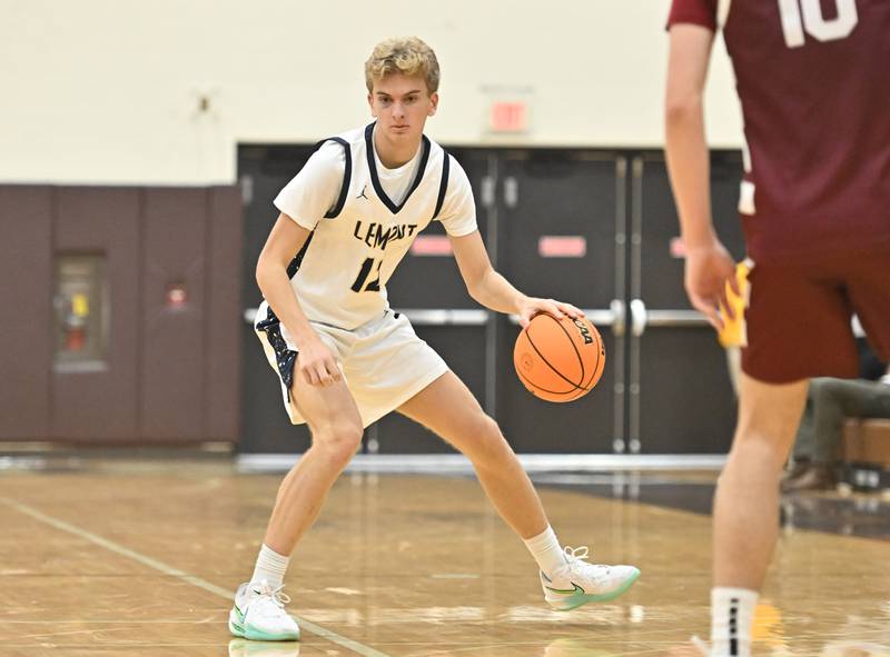 Lemont's Ryan Crane handles the ball during the WJOL tournament championship game against Lockport on Saturday, NOV. 29, 2025, at Joliet.