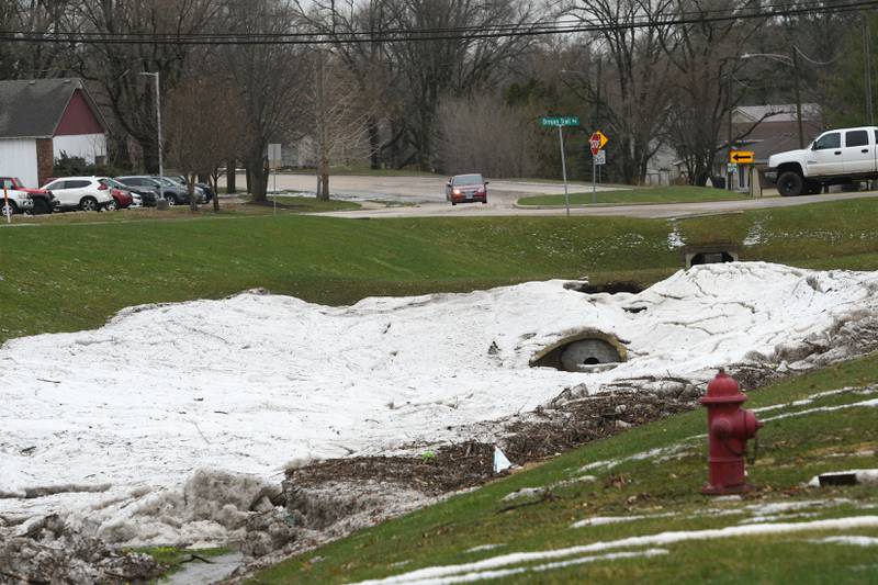 Heavy rain followed by a large hail storm hit Oregon April 4 jamming waterways like this one located along Illinois 64 north of town.