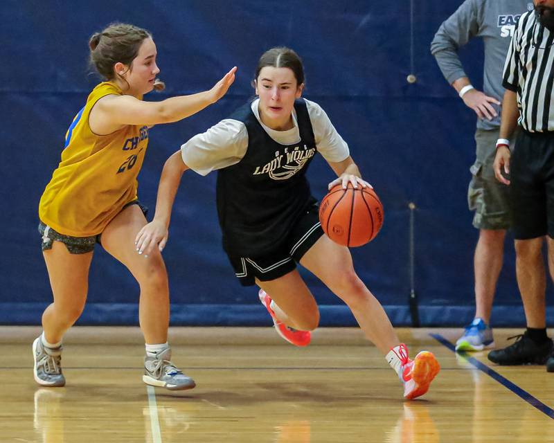 Oswego East's Maggie Lewendowski drives baseline at the Oswego Girls Basketball Shootout . June 30, 2023.