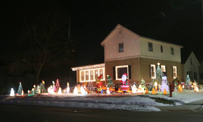 A view of a home decked out in Christmas lights at the corner of 6th and Fulton Street on Wednesday, Dec. 17, 2025 in Peru.