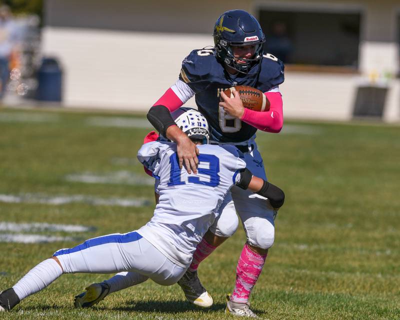 Hiawatha's Aiden Cooper (6) runs the ball before being brought down by Rockford Christian Life defender Ethan Vistine during the game on Saturday Oct. 11, 2025, held at Hiawatha High School.