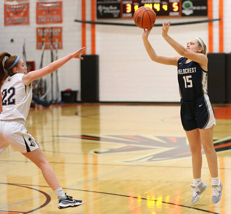 Fieldcrest's Vade Timmerman (15) shoots a wide-open jump shot over Marquette's Eva McCallum (22) in the Integrated Seed Lady Falcon Basketball Classic on Thursday, Nov. 17, 2022 in Flanagan.