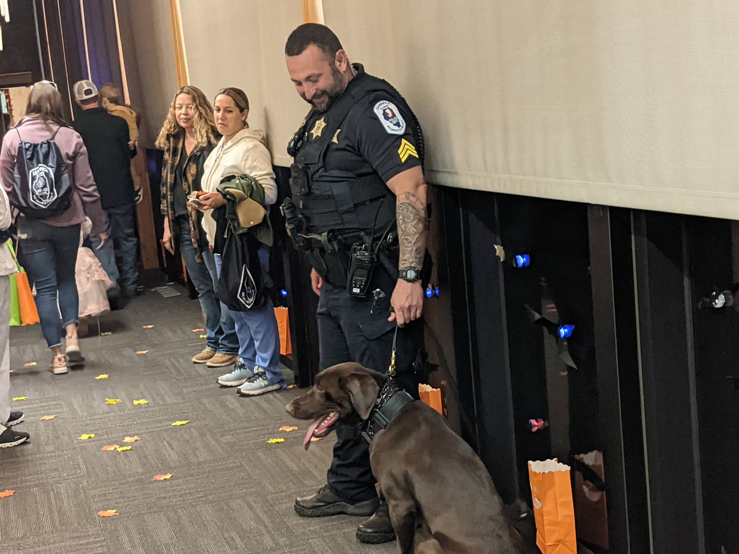 Sandwich Police Sgt. William Meisner stands next to the police department's new police dog, Musil, at the department's Halloween Bash on Oct. 23. Meisner is Musil's handler.
