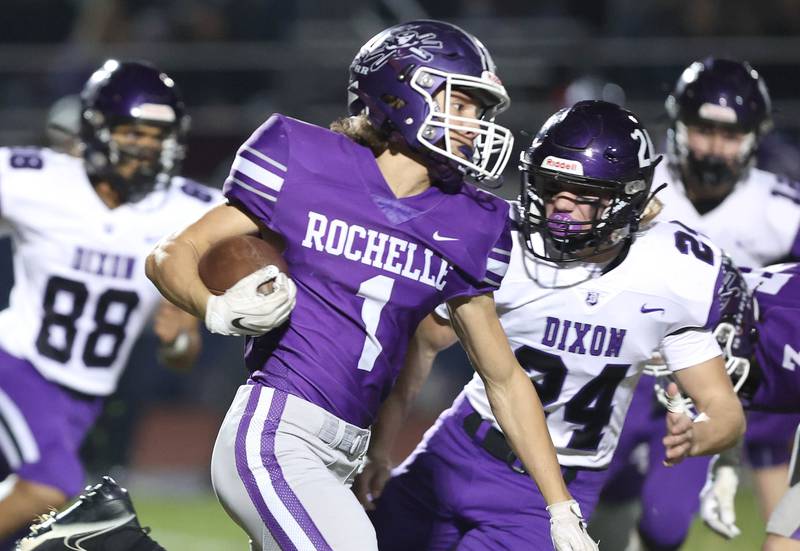 Rochelle's Grant Gensler tries to get outside of Dixon’s Hunter Vacek during their first round playoff game Friday, Oct. 28, 2022, at Rochelle High School.