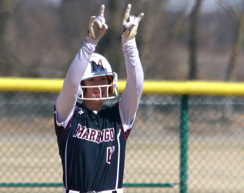 Marengo’s Jozsa Christiansen celebrates arriving safely at second base against North Boone in varsity softball at Marengo High School in Marengo on Saturday, March 22, 2025.