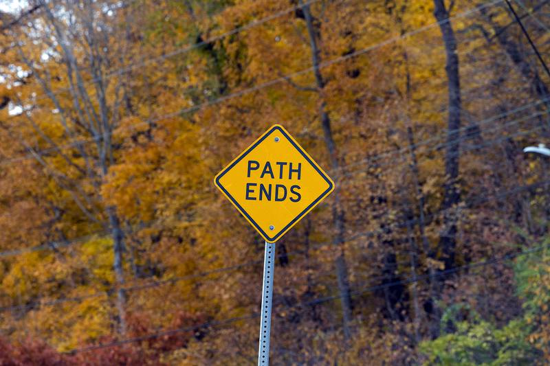 A sign marks the end of the east end of the Dixon multi-use path Thursday, Nov. 6, 2025, on River Road. Construction on an additional section of path leading to Raynor is in the works.