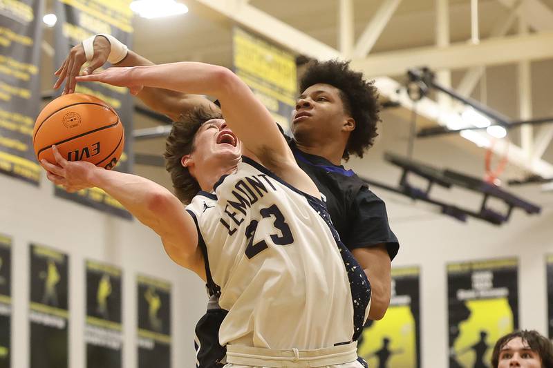 St. Francis’ Michael Hutchens blocks a shot by Lemont’s Lucas Glotzbach in the Class 3A Hinsdale South Regional semifinal game on Tuesday, March 3, 2026 in Darien.