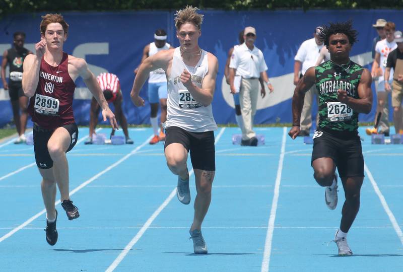Wheaton Academy's Emery Eckert, Sycamore's Aidan Wyzard, Providence Catholic's Leverett race in the 100 meter dash during the IHSA Class 2A Boys Track & Field State Finals on Saturday, May 31, 2025 at Eastern Illinois University in Charleston.