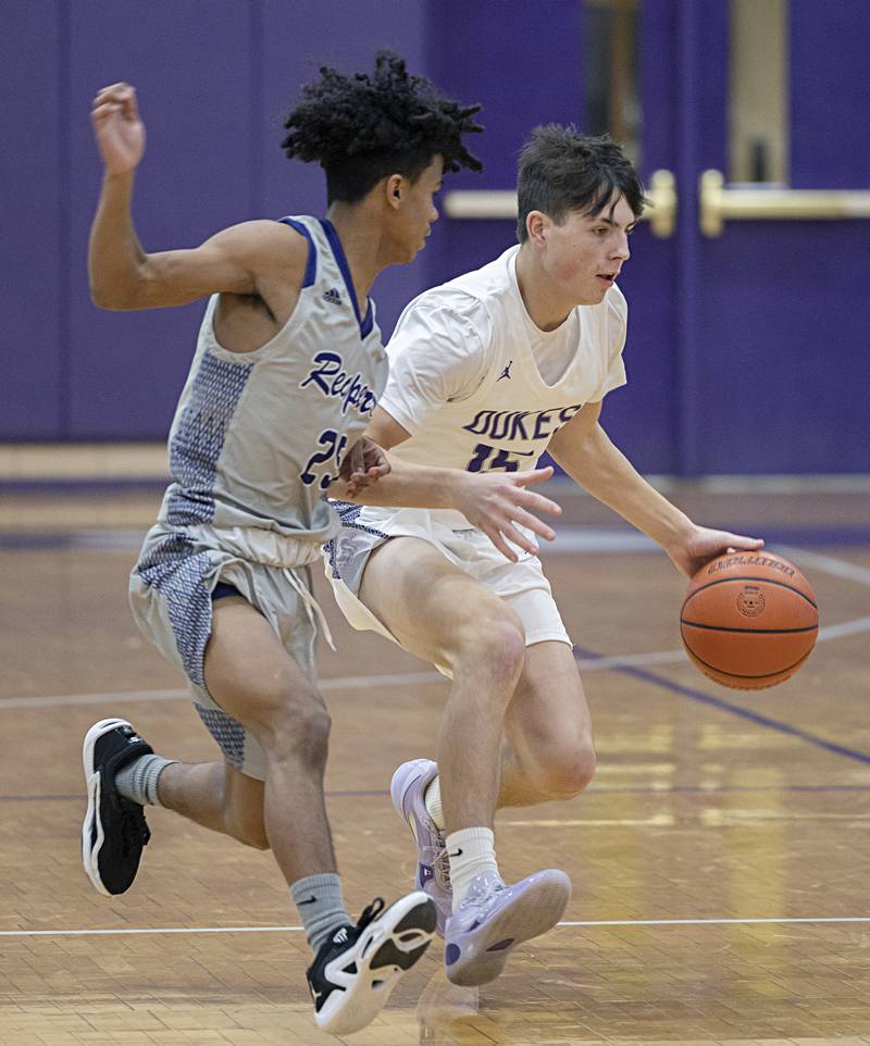 Dixon’s Alex Harrison dribbles against Plano Wednesday, Dec. 6, 2023 at Dixon High School.