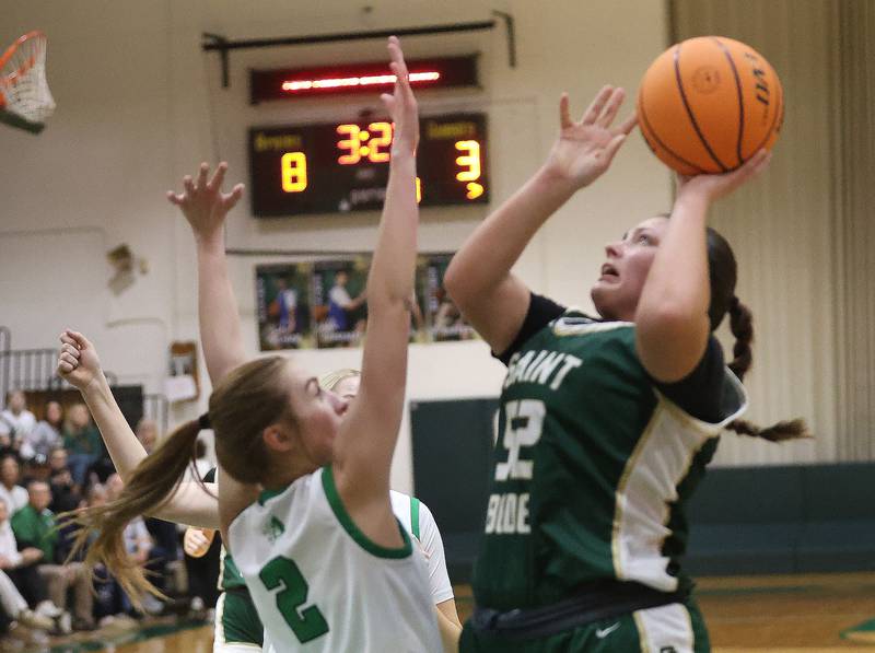 St. Bede's Ava Balestri eyes the hoop over Alleman's Lindsey Britton during the Class 2A Regional finals on Thursday, Feb. 19, 2026 at St. Bede Academy.