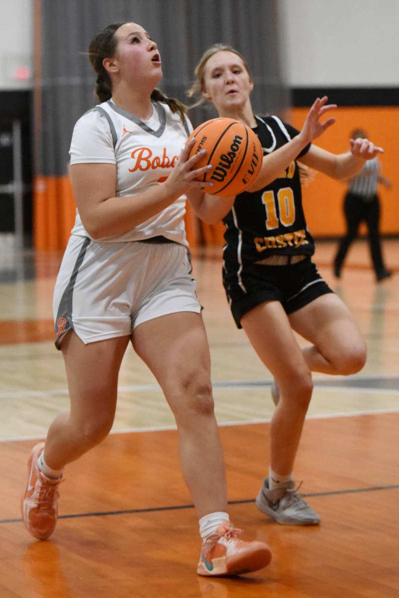 Beecher's Allie Johnson, left, drives to the basket as Reed-Custer's Kamryn Wilkey looks to perfectly time her block during a game at Beecher Tuesday, Jan. 20, 2026.
