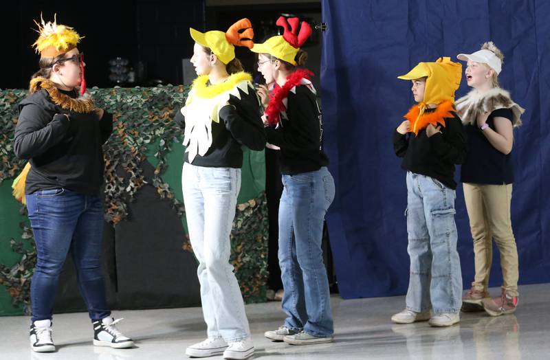 Sofia Scutt, Ceci Reynolds, Genevieve Vicich, Edythe Brockman and Hannah Skelly act out a scene during a rehearsal of "Once Upon A Time" on Tuesday, Nov. 12, 2024 at Marquette Grade School. The production is a story theatre featuring a collection of stories written from the stories in the collection of the Grimm Brothers and Aesop's Fables.