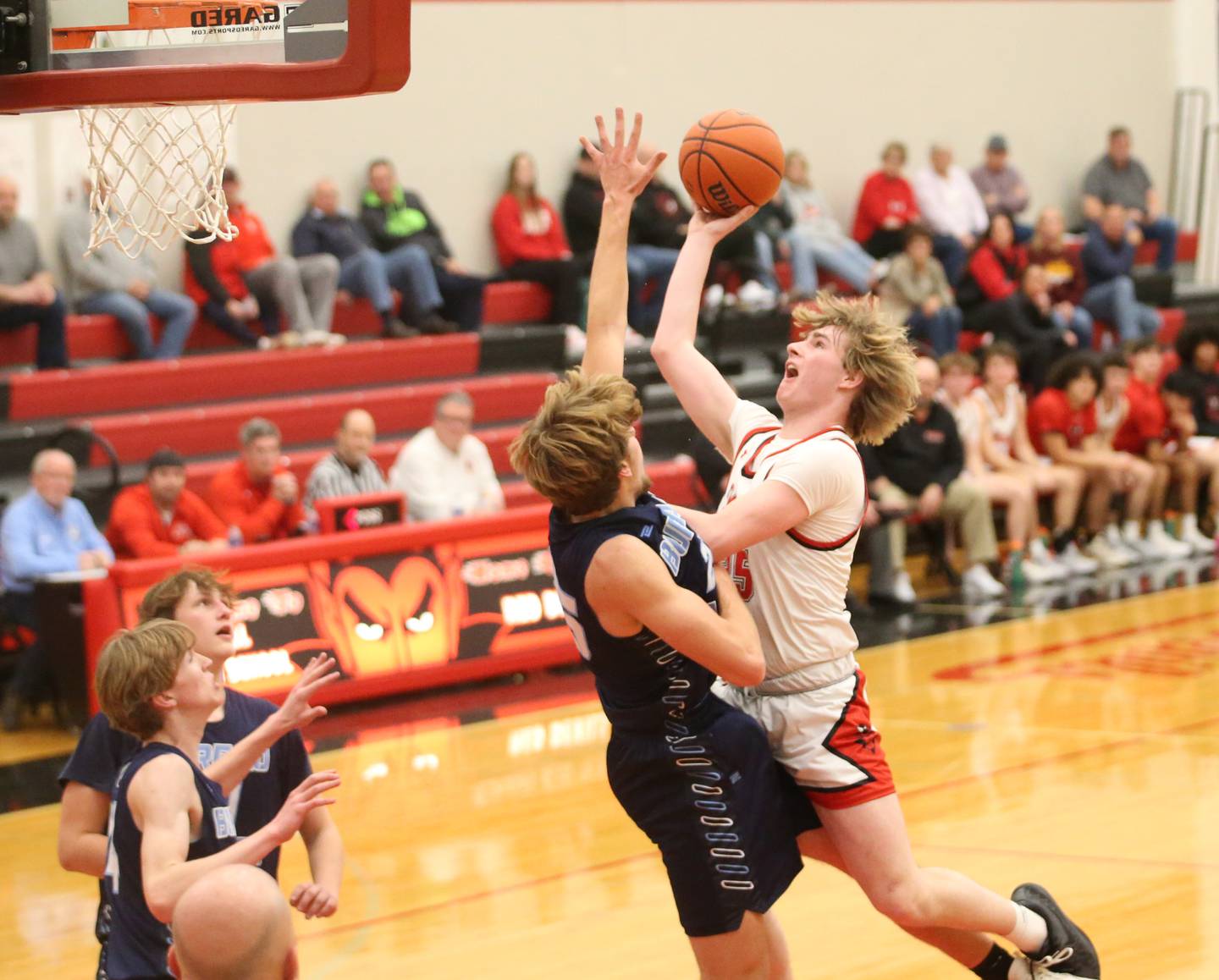 Hall's Wyatt West eyes the hoop as Bureau Valley's Landon Hulsing defends on Tuesday, Feb. 6, 2024 at Hall High School.