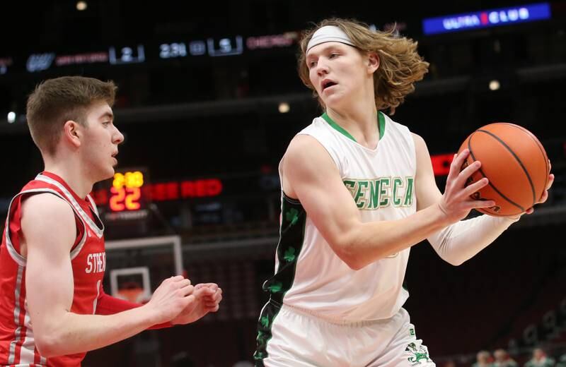 Seneca's Grant Siegel looks to pass the ball off as Streator's Cade Peterson defends during a game on Tuesday, Dec. 21, 2023 at the United Center in Chicago.