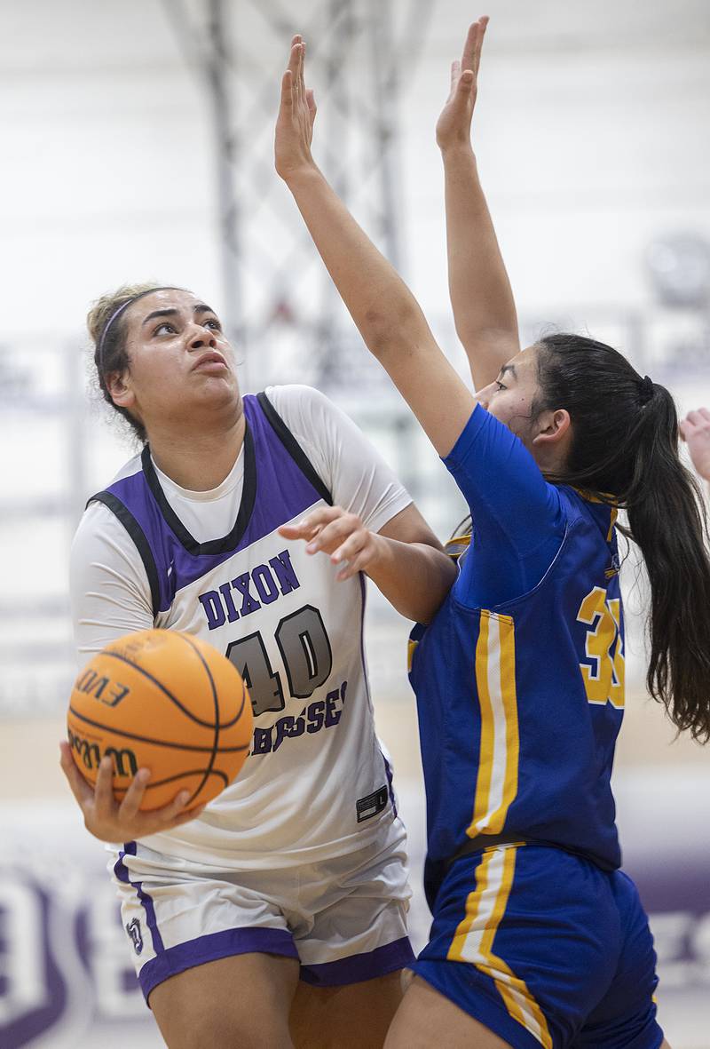 Dixon's Hallie Williamson puts up a shot against Aurora Central’s Sofia Corral Thursday, Dec. 26, 2024, during the Dixon Girl’s KSB Holiday Basketball Classic.