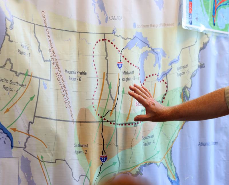 Mike Redmer, state private lands coordinator for the United States Fish and Wildlife Service, explains migration patterns during Monarchs and Music at Crystal Lake Main Beach Sunday.