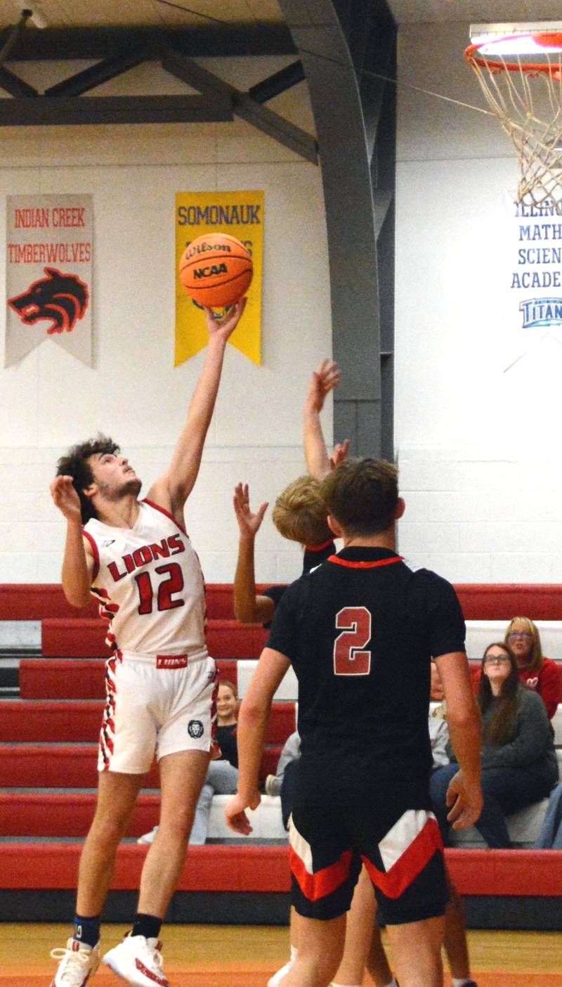 LaMoille's Gavin Moore goes in for a layup in Saturday's game vs. Amboy at Dean Madsen Gymnasium.