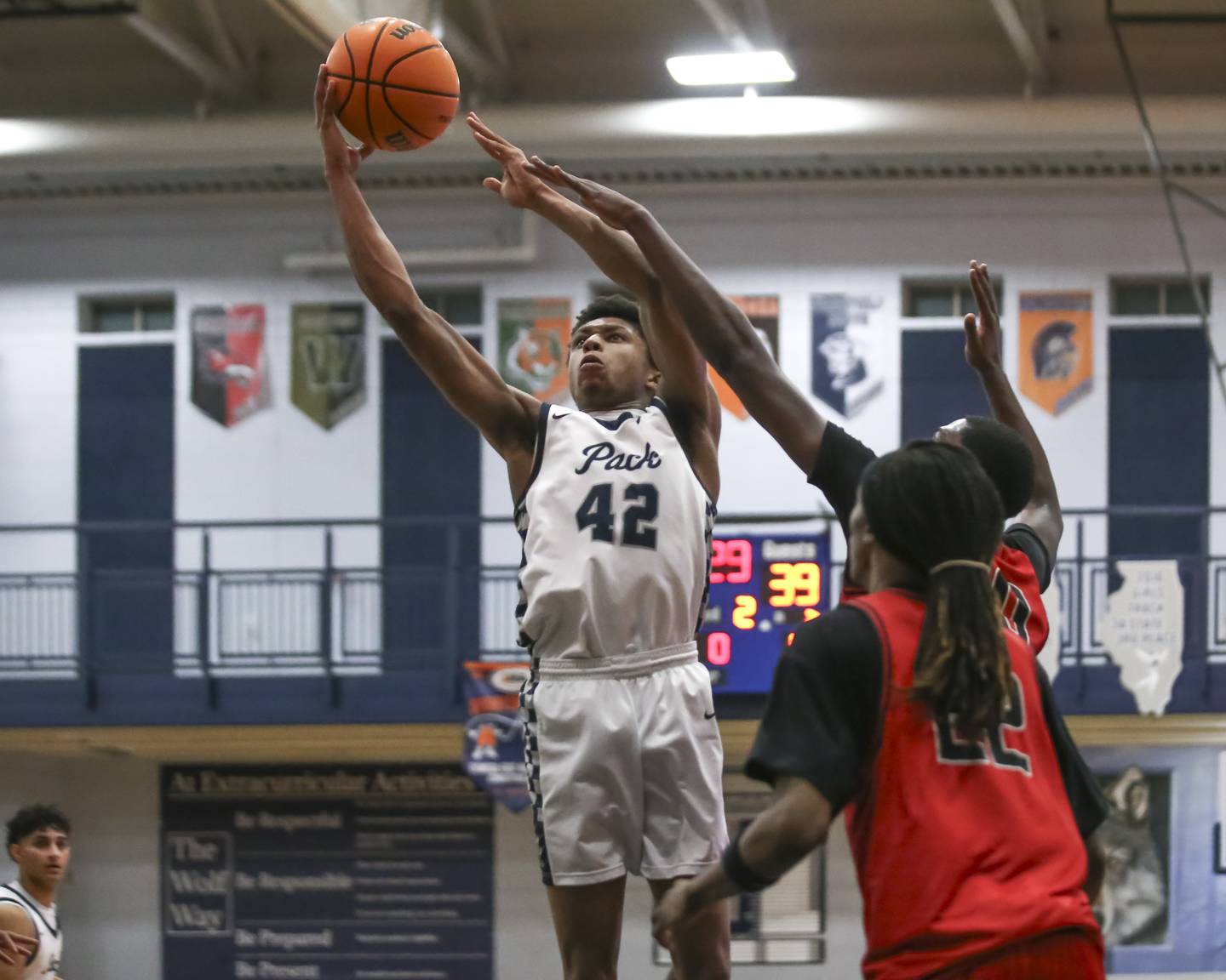Oswego East's Dshaun Bolden (42) goes in for a layup during their basketball game between Bolingbrook at Oswego East Friday, Jan 30, 2026 in Oswego.