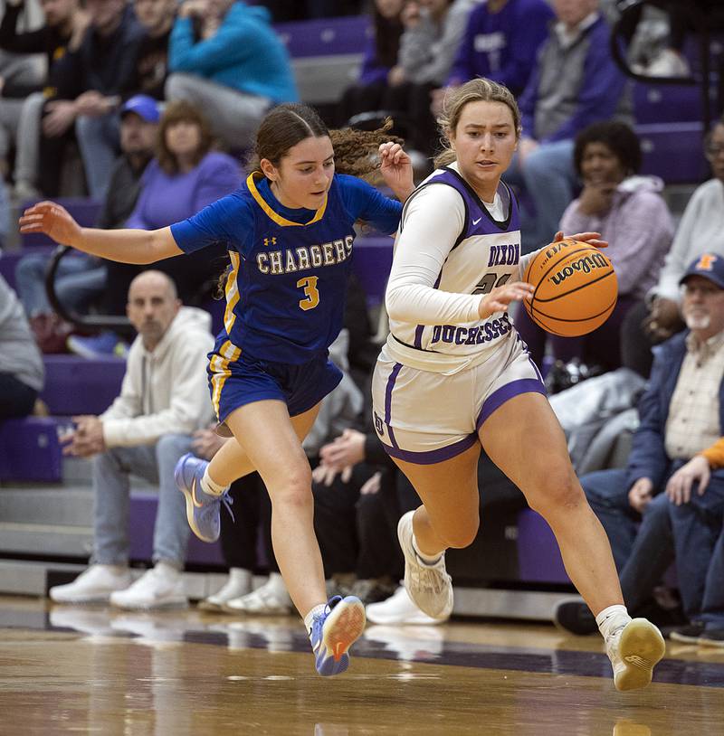 Dixon's Reese Dambman brings the ball up court against Aurora Central’s Gina Dutkanych Thursday, Dec. 26, 2024, during the Dixon Girl’s KSB Holiday Basketball Classic.