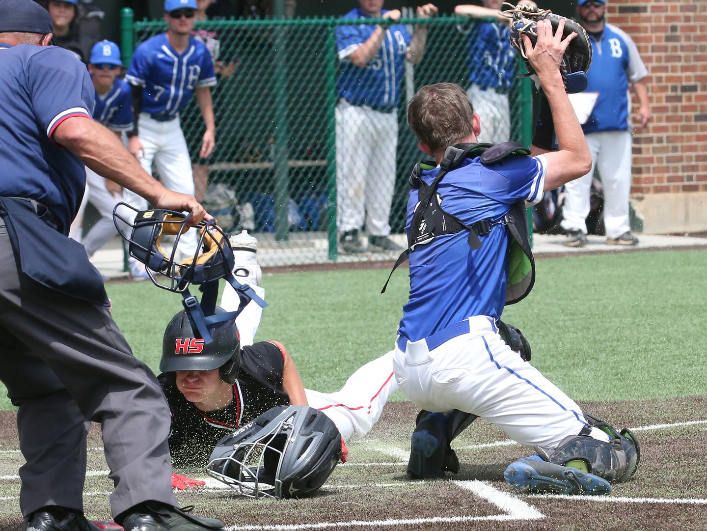 Henry-Senachwine's Preston Rowe scores the teams third run as Milford's catcher Sawyer Laffoon catches the late throw to the plate during the Class 1A Supersectional game on Monday, May 29, 2023 at Illinois Wesleyan University in Bloomington.