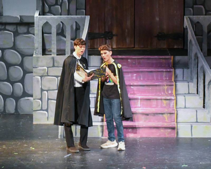 Downers Grove North Students Quinn McCloud, right, who plays Wayne and Caleb McCloud who plays Cedric preforms in the production of Puffs on Saturday Nov. 23, 2024, held at Downers Grove North’s auditorium.