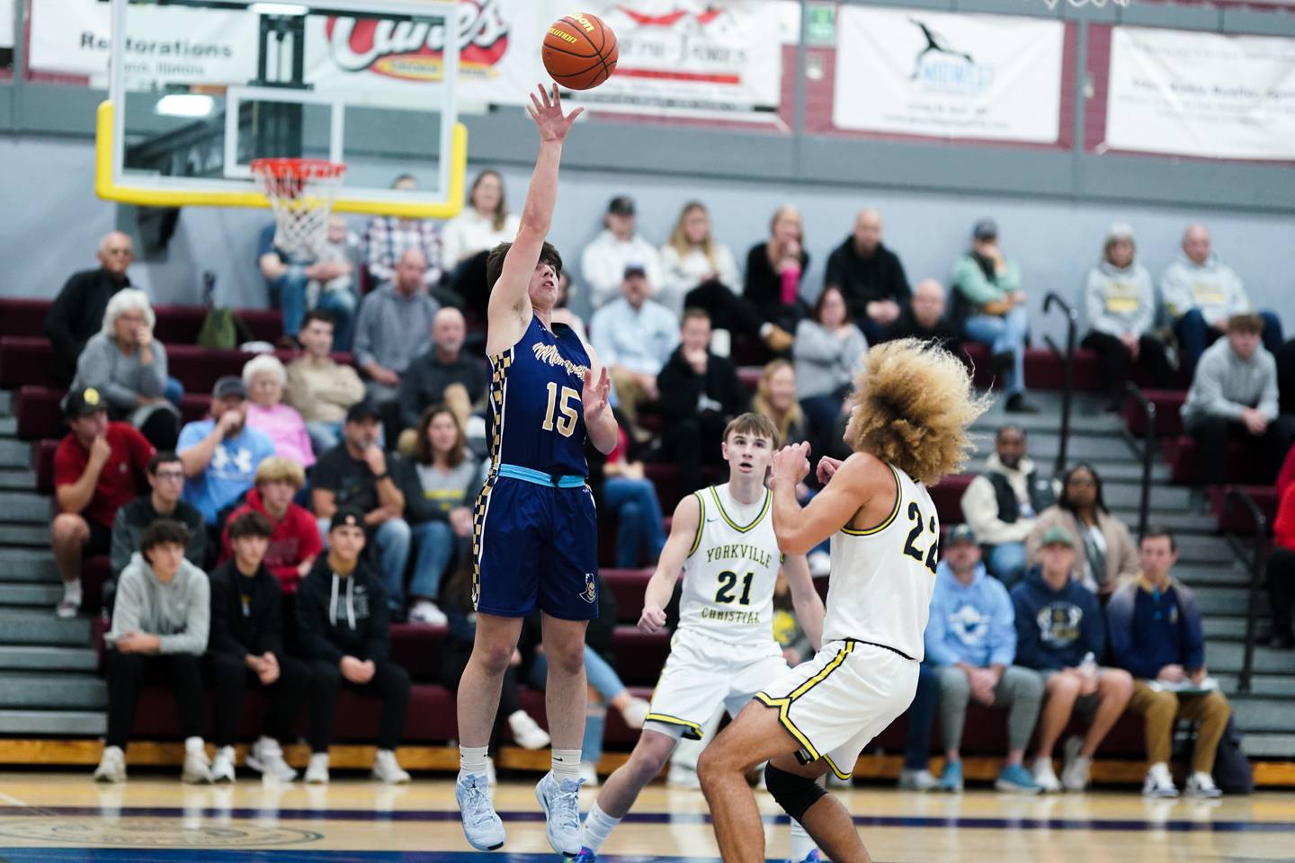 Marquette's Alec Novotney (15) shoots a float along the baseline against Yorkville Christian's Noah Aguado (22) during a basketball game at Yorkville Christian High School on Tuesday, Dec. 17, 2024.