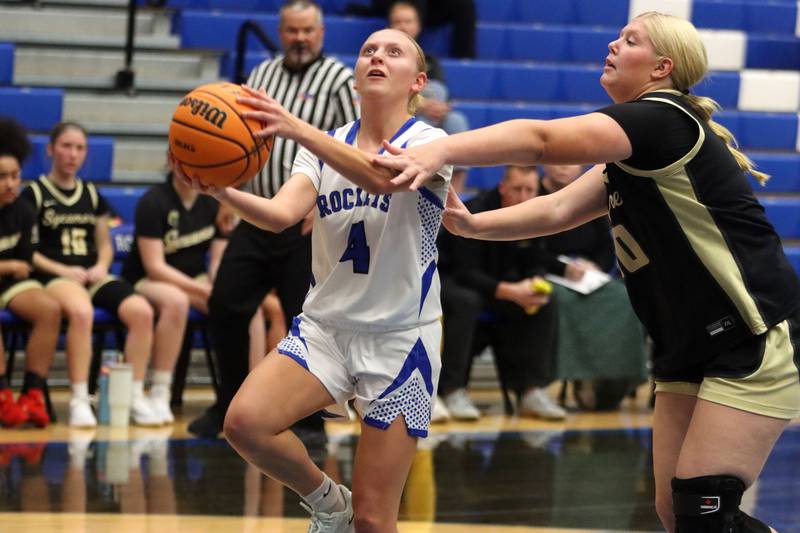 Burlington Central’s Ashley Waslo, left, gets past  Sycamore’s Cami Knox in girls basketball at Burlington Central High School in Burlington on Tuesday, November 18, 2025.