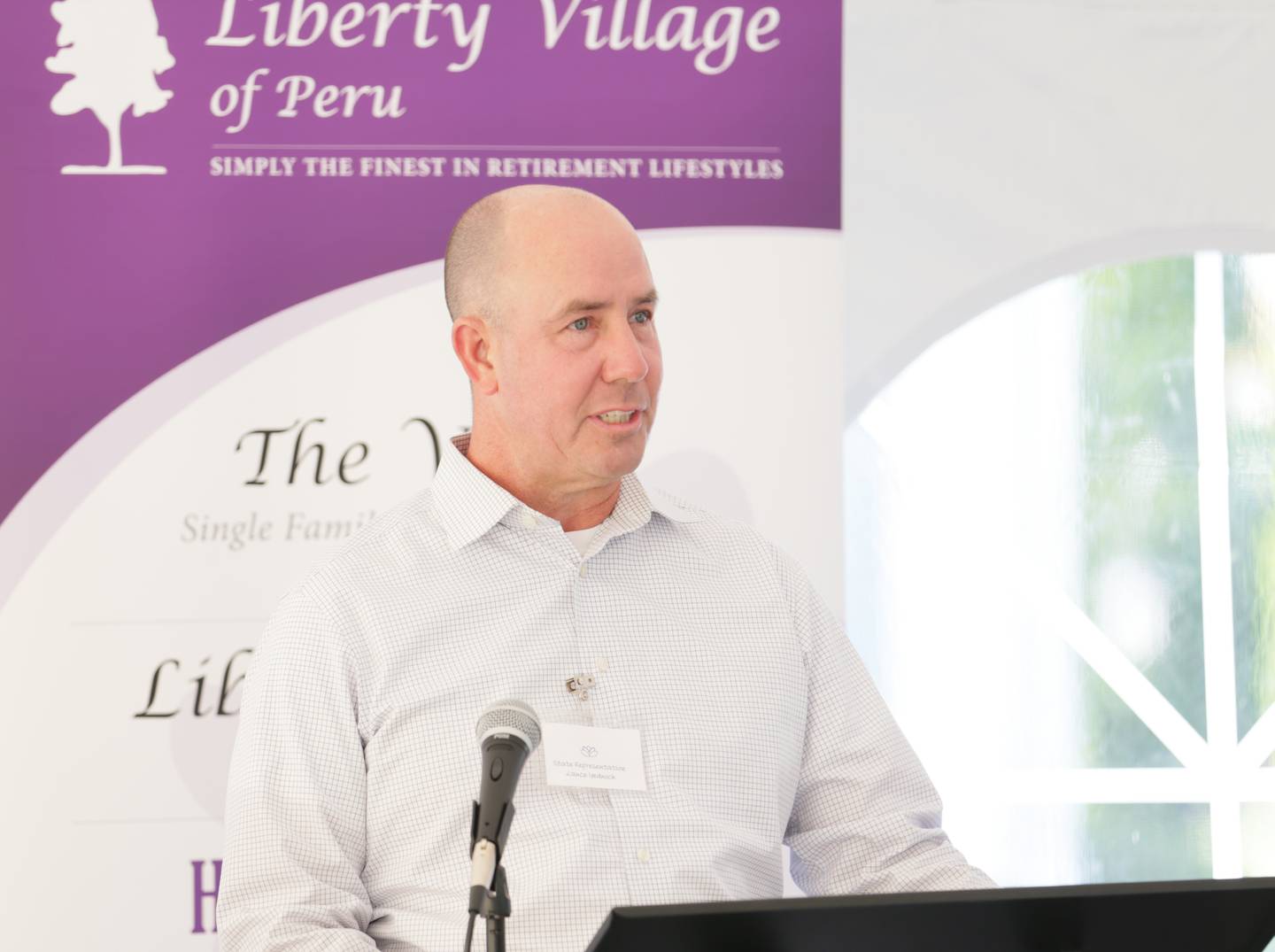 State Rep. Yednock, D-Ottawa speaks to a crowd during the Memory Lane ribbon cutting ceremony on Thursday, Sept. 22, 2022 at Liberty Village in Peru.