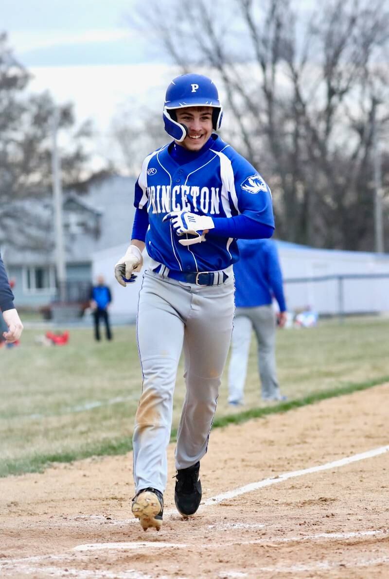 Princeton's Augie Christiansen is all smiles after scoring a run in the Tigers' 4-1 win over rival Hall Monday at Prather Field.