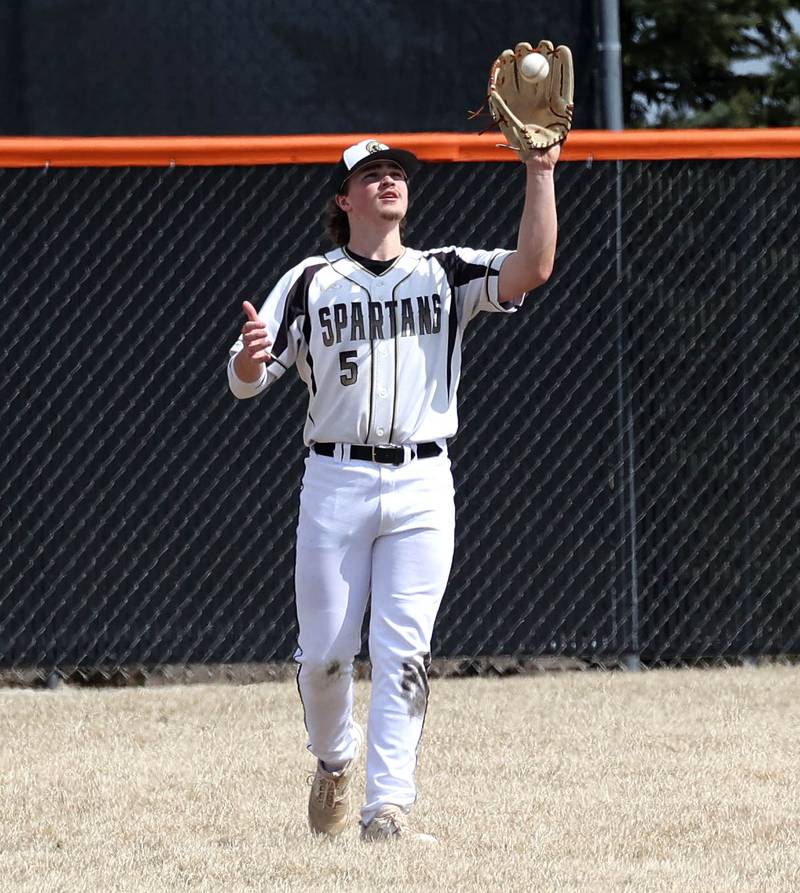 Sycamore's Tyler Lojko catches a flyable in center field during their game against Byron Wednesday, March 26, 2025, at DeKalb High School. Sycamore’s home field was damaged in last week’s storms so today’s game was played on DeKalb’s field.