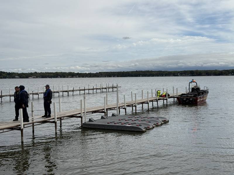 Divers from the Antioch Fire Protection District and a sonar team from the Illinois Department of Natural Resources continue searching Tuesday, Oct. 7, 2025, on Fox Lake near Antioch for a man thrown from a boat he was test driving Monday night.