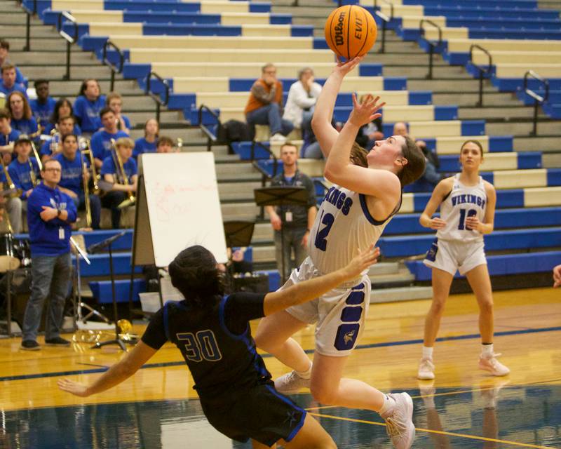 Geneva's Gabby Webb draws the block by St. Charles North's Lelanie  Posada on Friday, Jan. 17,2025 in Geneva.