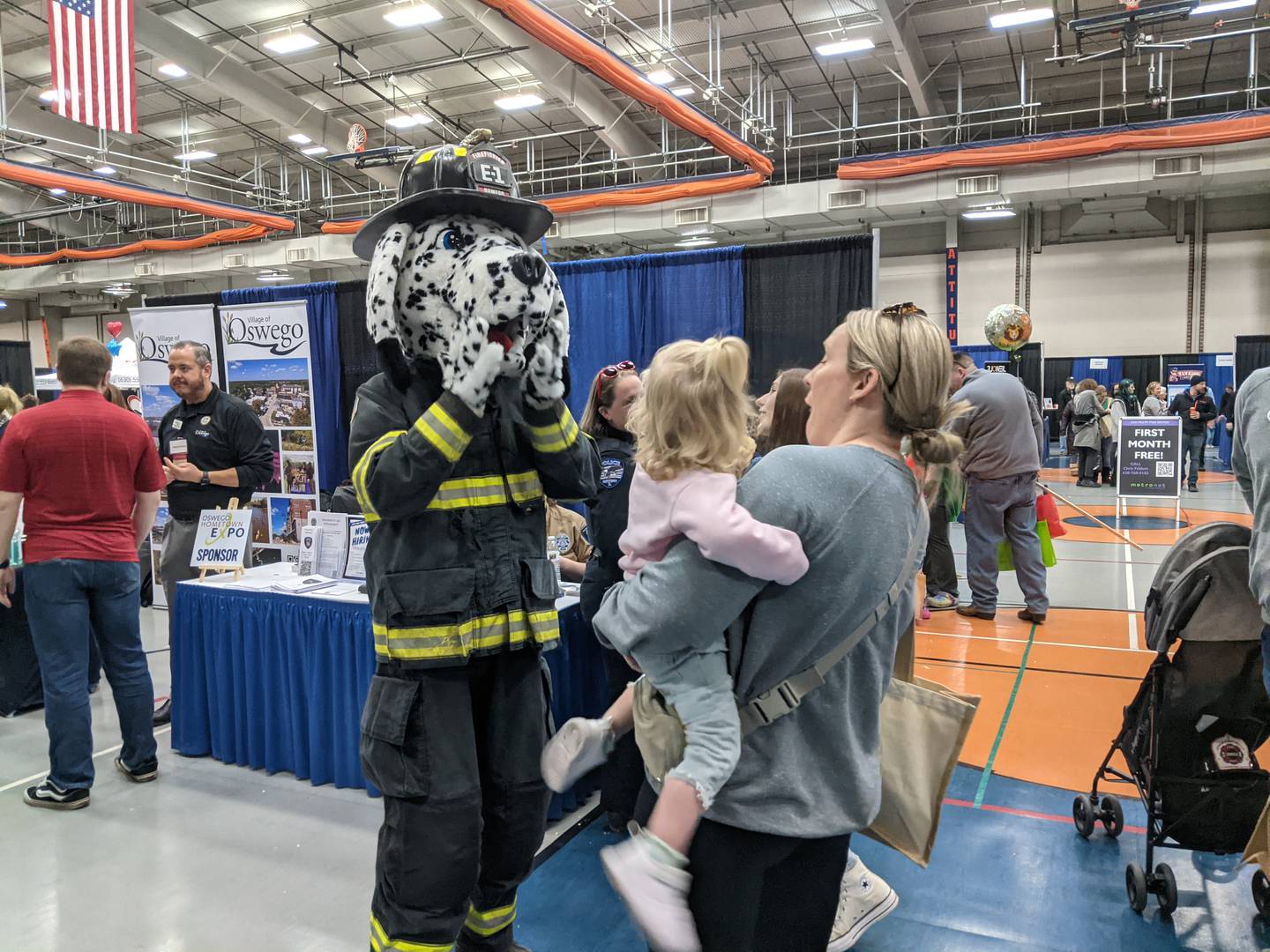 Pumper, the Oswego Fire Protection District’s mascot dog, greeted people as they walked around the Oswego Hometown Expo on Feb. 22 at Oswego High School.