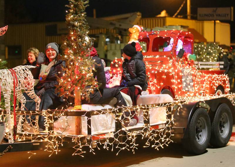 A Christmas float makes its way down Peoria Street during the Light up the Night parade on Saturday, Dec. 3, 2022 downtown Peru.