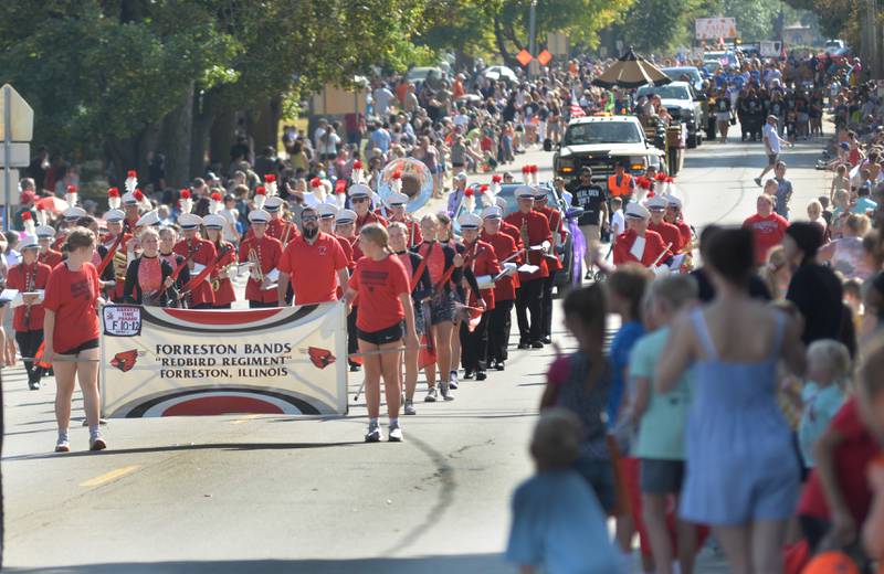 Forreston High School's "Redbird Regiment" performs in front of a large crowd along the Harvest Time Parade during Autumn on Parade on Sunday, Oct. 5, 2025 in Oregon.